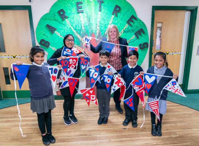 A ‘ROYAL Mile’ of bunting has been designed by primary schools in Oldham to mark the Queen’s Platinum Jubilee