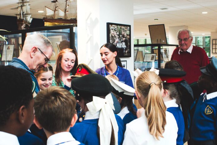 Mike Winstanley shows the pupils his medals